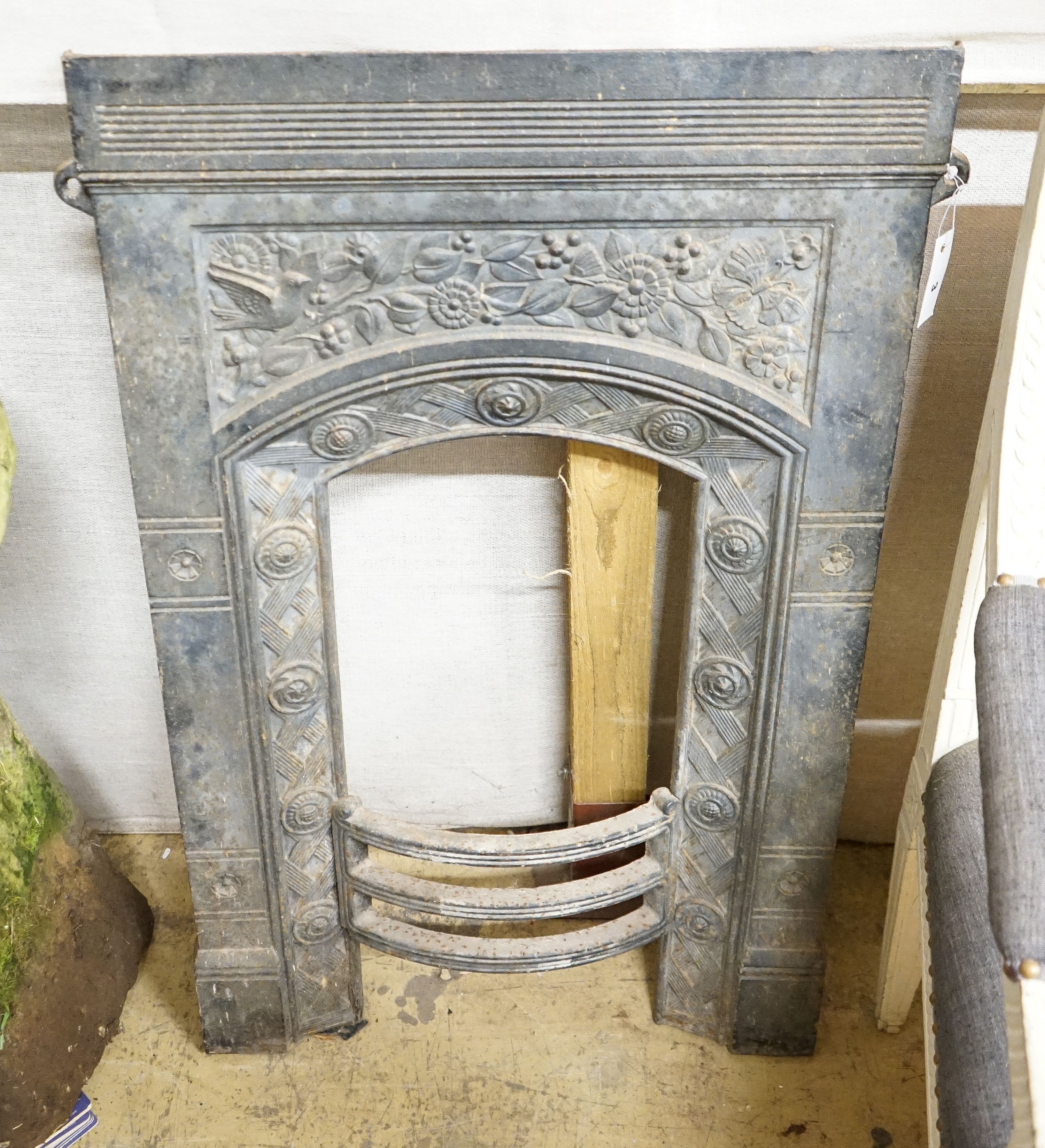 A Victorian cast iron fire insert, Thomas Jekyll, width 62cm, height 94cm